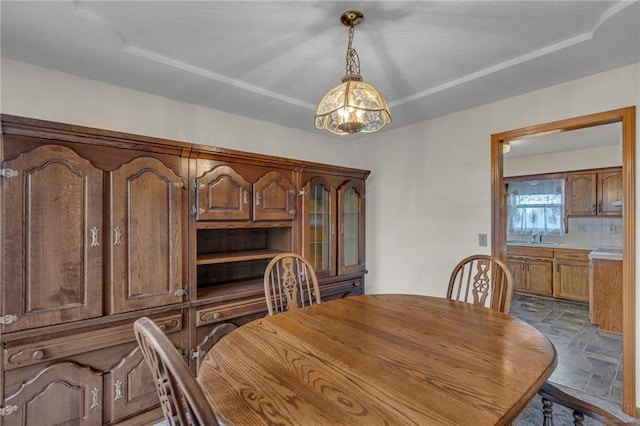 dining space featuring sink