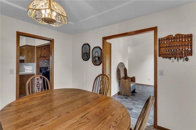 dining space with a chandelier