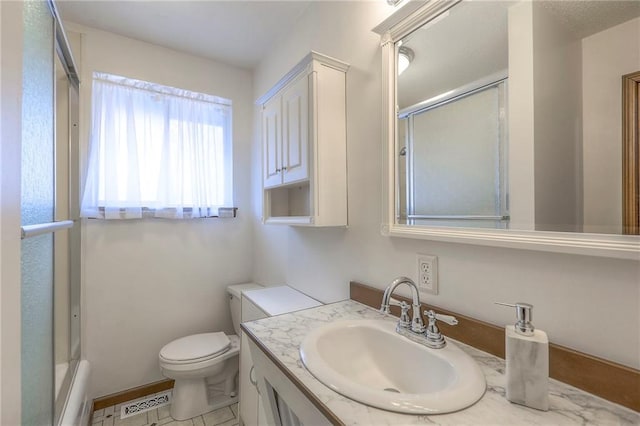 bathroom with walk in shower, vanity, and toilet