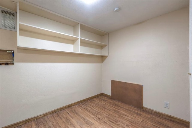 empty room featuring hardwood / wood-style flooring