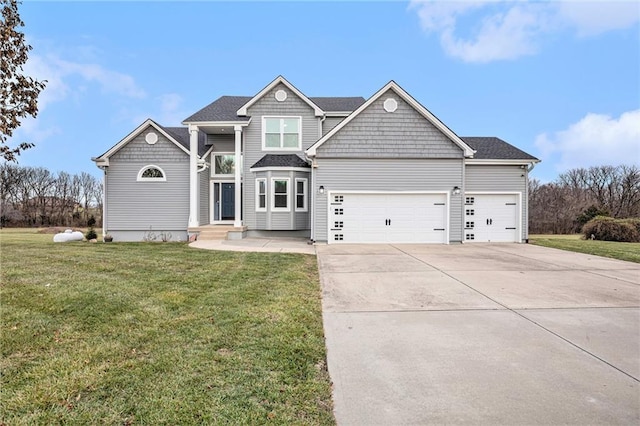 view of front facade featuring a garage and a front yard