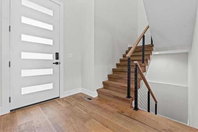 entryway with hardwood / wood-style flooring