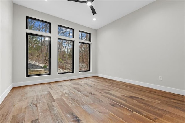 spare room featuring ceiling fan and light wood-type flooring