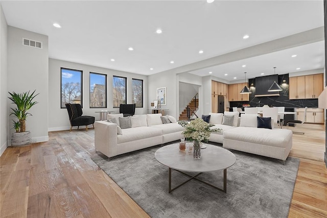 living room with light hardwood / wood-style flooring