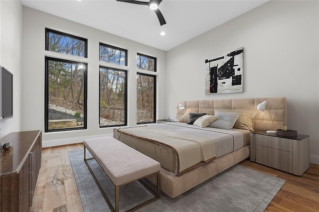 bedroom with ceiling fan and hardwood / wood-style floors