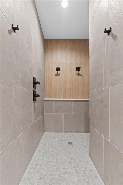 bathroom with tiled shower