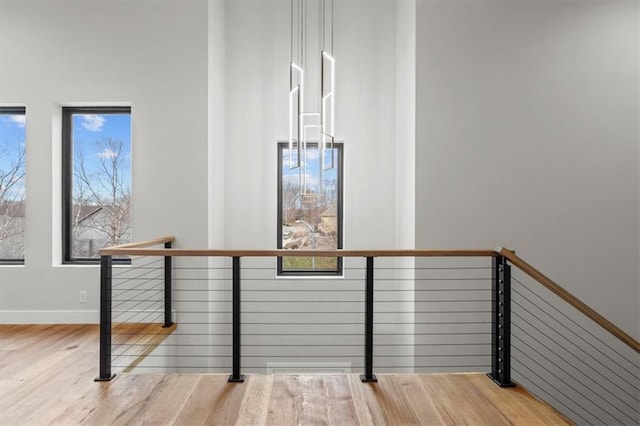 stairs featuring hardwood / wood-style floors