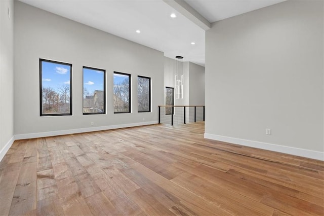 spare room featuring light wood-type flooring