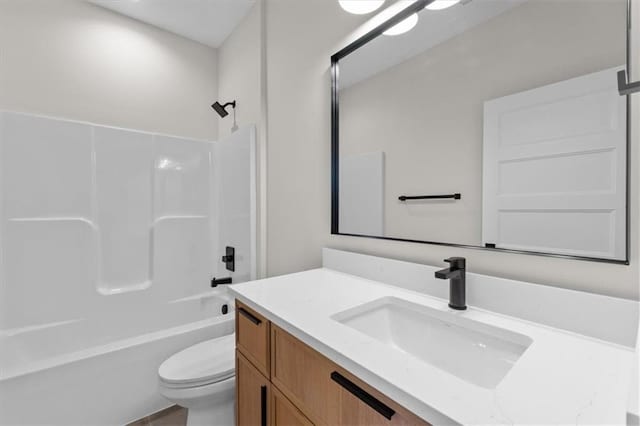 full bathroom featuring vanity, shower / bath combination, and toilet