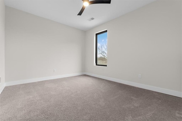 spare room with carpet and ceiling fan