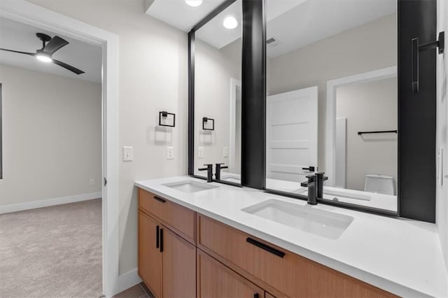 bathroom with ceiling fan, toilet, and vanity