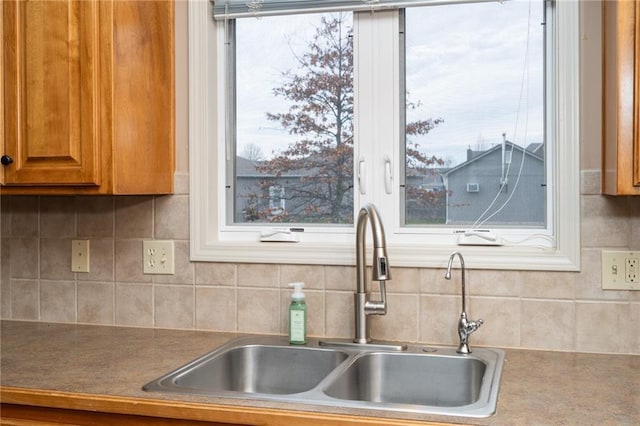 kitchen with tasteful backsplash and sink