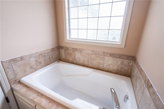 bathroom featuring a relaxing tiled tub