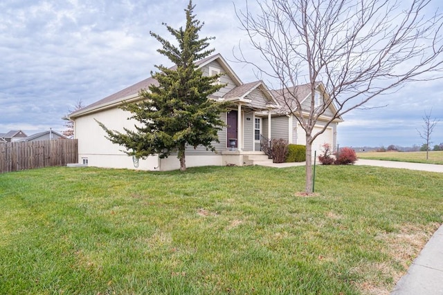 obstructed view of property featuring a front yard