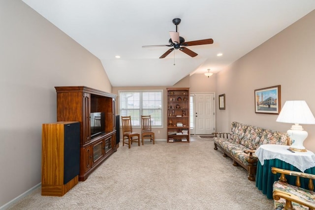 living room with light carpet, vaulted ceiling, and ceiling fan