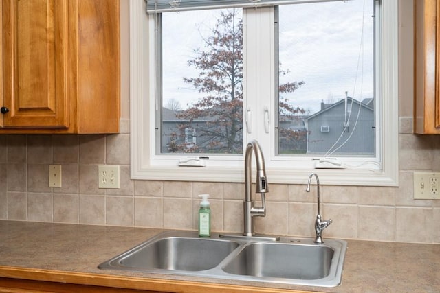 kitchen with decorative backsplash and sink