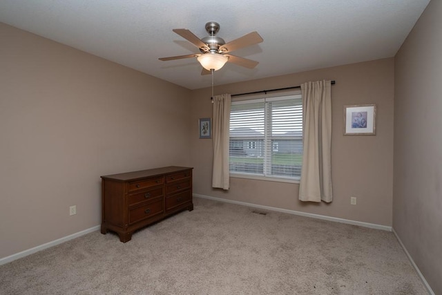 unfurnished bedroom with light carpet and ceiling fan