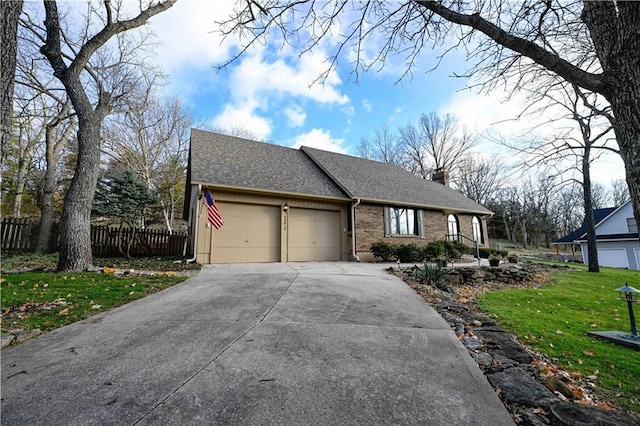 single story home with a front yard and a garage