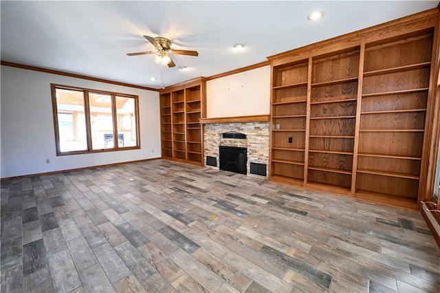 unfurnished living room with a fireplace, dark hardwood / wood-style flooring, ceiling fan, and ornamental molding