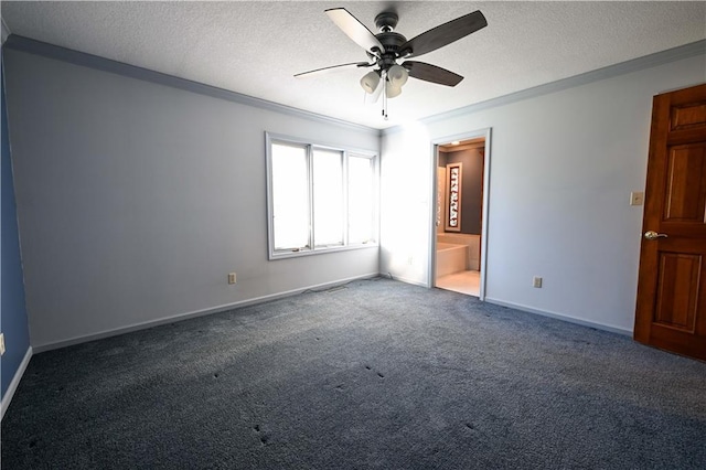 unfurnished bedroom featuring ensuite bath, ceiling fan, dark colored carpet, a textured ceiling, and ornamental molding