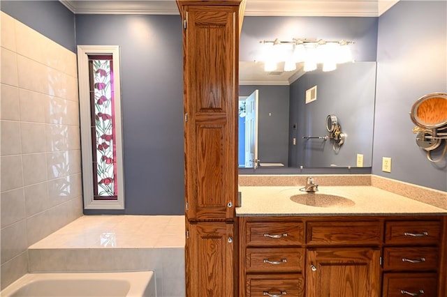 bathroom with a tub, crown molding, and vanity