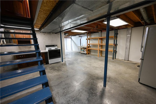 basement featuring white fridge