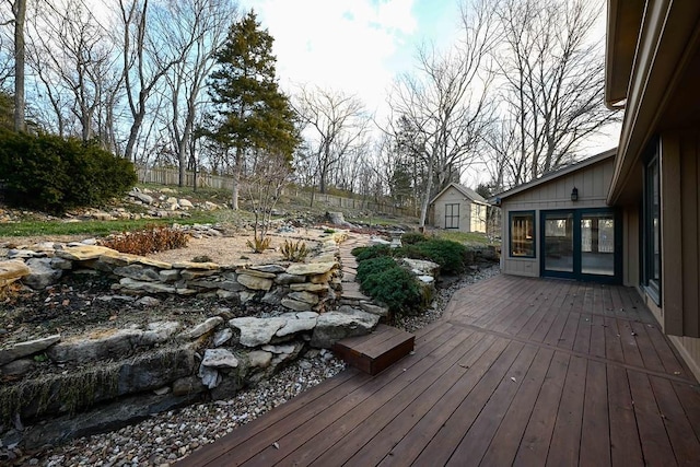 wooden deck featuring a storage shed