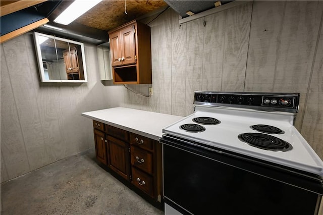 22812 E Bradford Ln, Blue Springs, MO 64015 - kitchen with range with electric cooktop, unfinished concrete flooring, light countertops, and wood walls