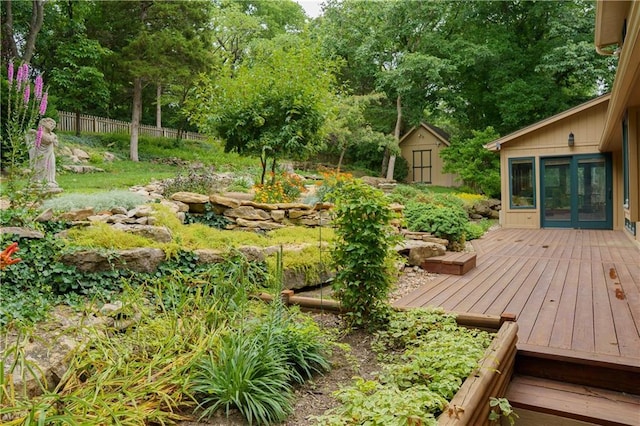 22812 E Bradford Ln, Blue Springs, MO 64015 - deck featuring a shed, french doors, and view of scattered trees