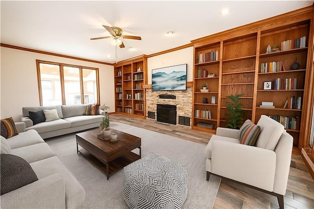 22812 E Bradford Ln, Blue Springs, MO 64015 - living room featuring ceiling fan, ornamental molding, a stone fireplace, wood finished floors, and recessed lighting