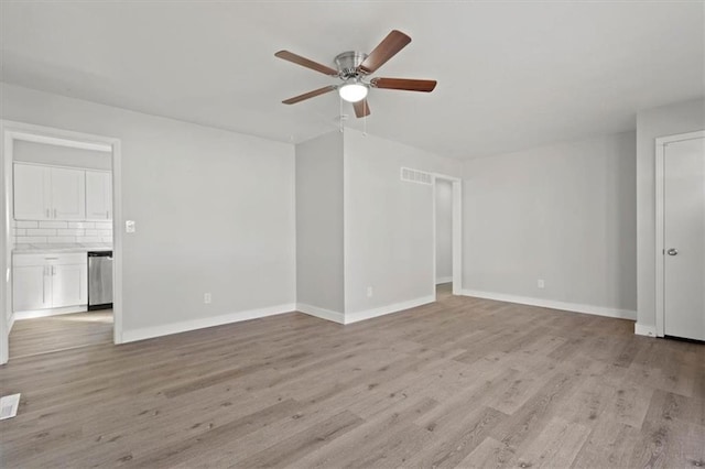 empty room featuring ceiling fan and light wood-type flooring