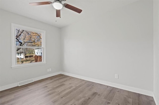 spare room featuring ceiling fan and light hardwood / wood-style floors