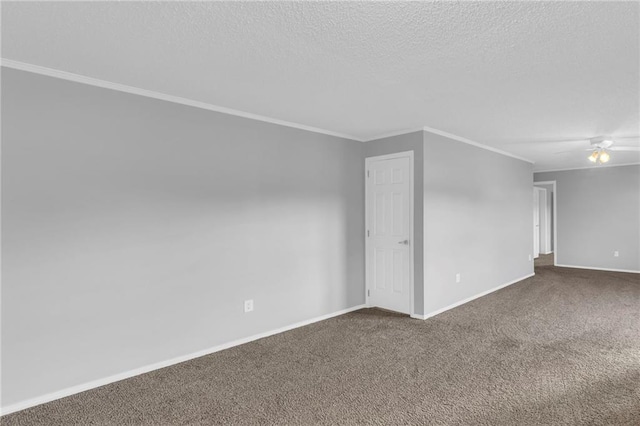 carpeted spare room featuring ceiling fan, ornamental molding, and a textured ceiling