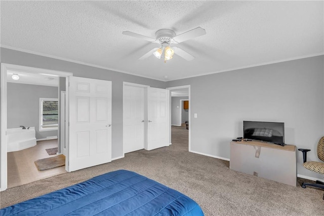 carpeted bedroom with ceiling fan, ornamental molding, and a textured ceiling