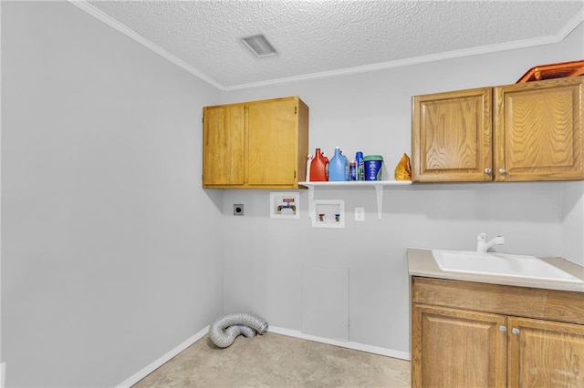 clothes washing area with cabinets, sink, hookup for a washing machine, ornamental molding, and hookup for an electric dryer