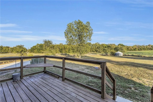 wooden terrace with a storage shed