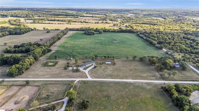 birds eye view of property featuring a rural view