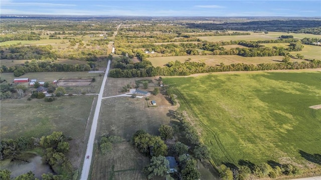 birds eye view of property with a rural view