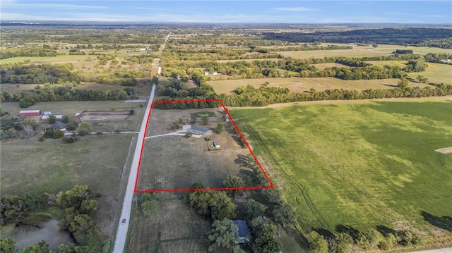 birds eye view of property featuring a rural view