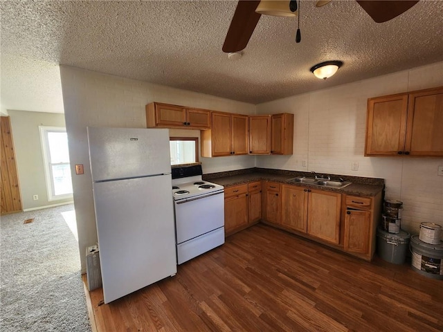 kitchen with a textured ceiling, ceiling fan, sink, and white appliances