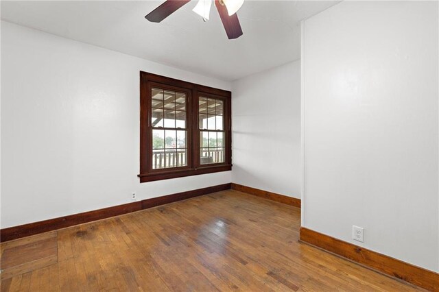 121 W US Highway 40, Odessa, MO 64076 - empty room with wood-type flooring and a ceiling fan