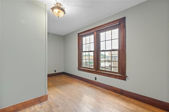 unfurnished room with light hardwood / wood-style flooring