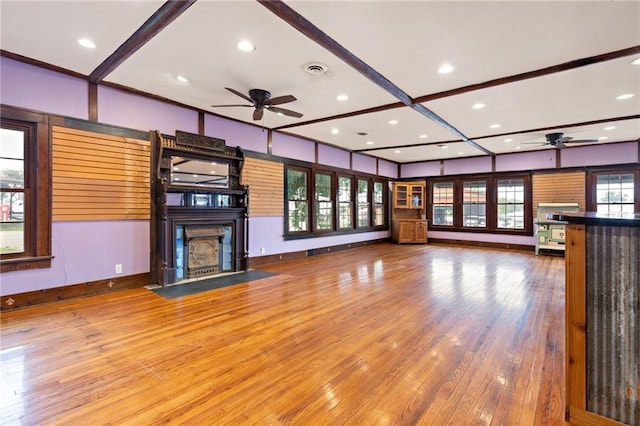 121 W US Highway 40, Odessa, MO 64076 - unfurnished living room featuring a ceiling fan, wood finished floors, a fireplace with flush hearth, and recessed lighting
