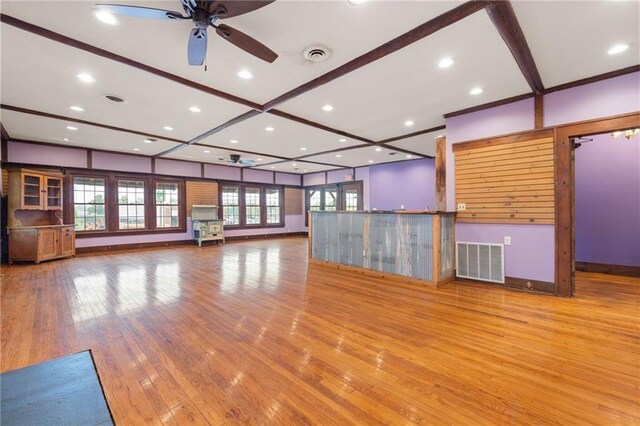 121 W US Highway 40, Odessa, MO 64076 - unfurnished living room with a ceiling fan, wood finished floors, and recessed lighting