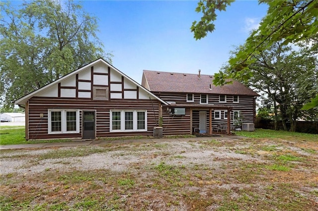 rear view of house with central AC