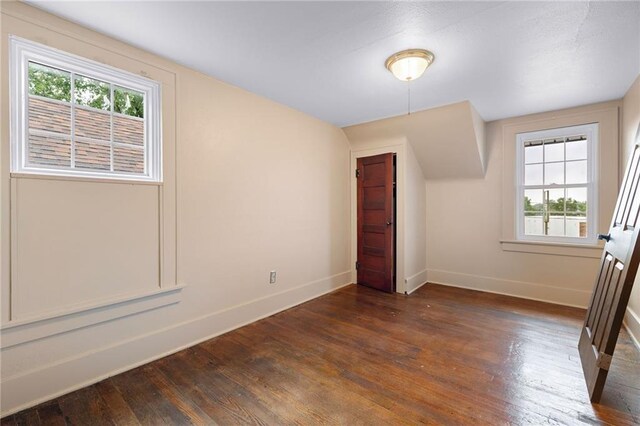121 W US Highway 40, Odessa, MO 64076 - bonus room with dark wood finished floors and baseboards