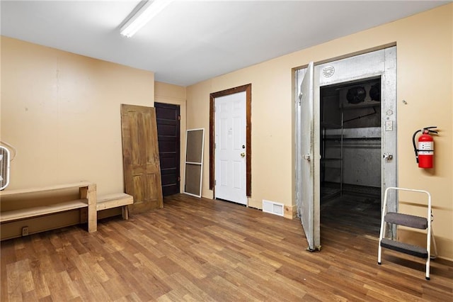 interior space with hardwood / wood-style flooring