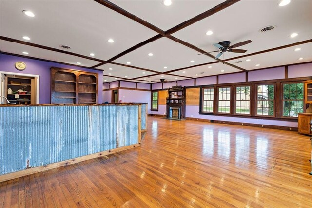 121 W US Highway 40, Odessa, MO 64076 - unfurnished living room featuring ceiling fan, wood finished floors, and recessed lighting