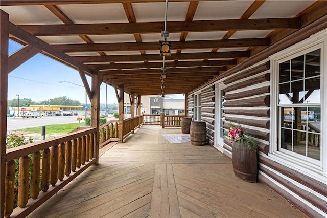 wooden terrace featuring covered porch