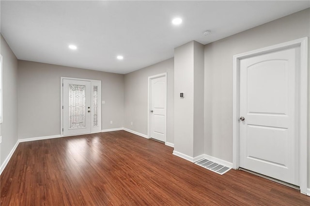 spare room with hardwood / wood-style flooring